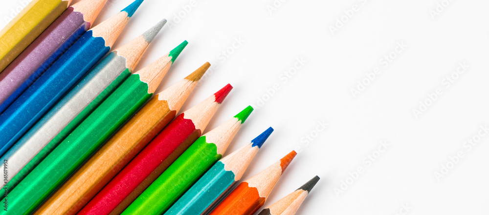 Color wooden pencils isolated on white background. Multi-colored palette for drawing, place for text. Color wooden pencils isolated on white background. Multi-colored palette for drawing, place for text.