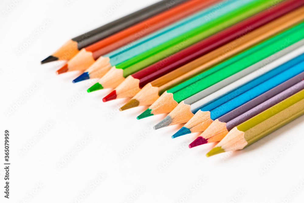 Color wooden pencils isolated on white background. Multi-colored palette for drawing, place for text. Color wooden pencils isolated on white background. Multi-colored palette for drawing, place for text.