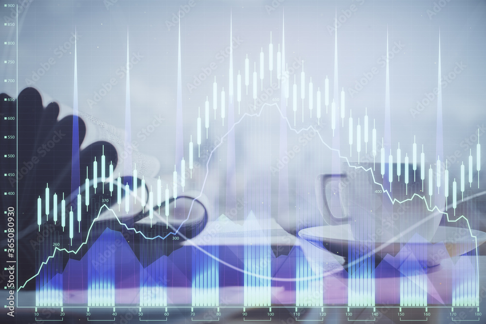 Double exposure of financial chart drawing and desktop with coffee and items on table background. Concept of forex market trading Double exposure of financial chart drawing and desktop with coffee and items on table background. Concept of forex market trading