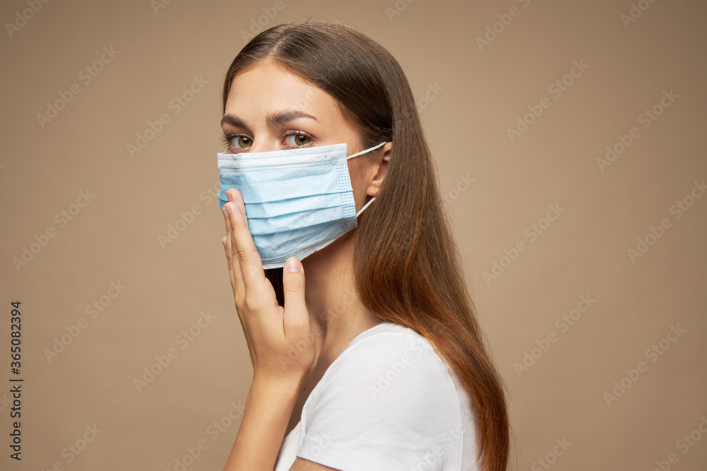 Lady stylish clothes in a medical mask flu virus 