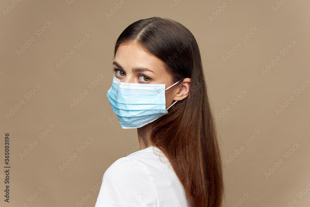 Attractive woman stylish clothes in a face mask allergy Attractive woman stylish clothes in a face mask allergy