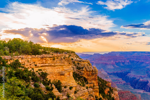 Panoramic image of the colorful Sunset on the Grand Canyon in Grand Canyon National Park from the south rim part Arizona USA  on a sunny cloudy day with blue or gloden sky
