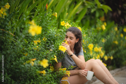 Young cute woman smelling y...
