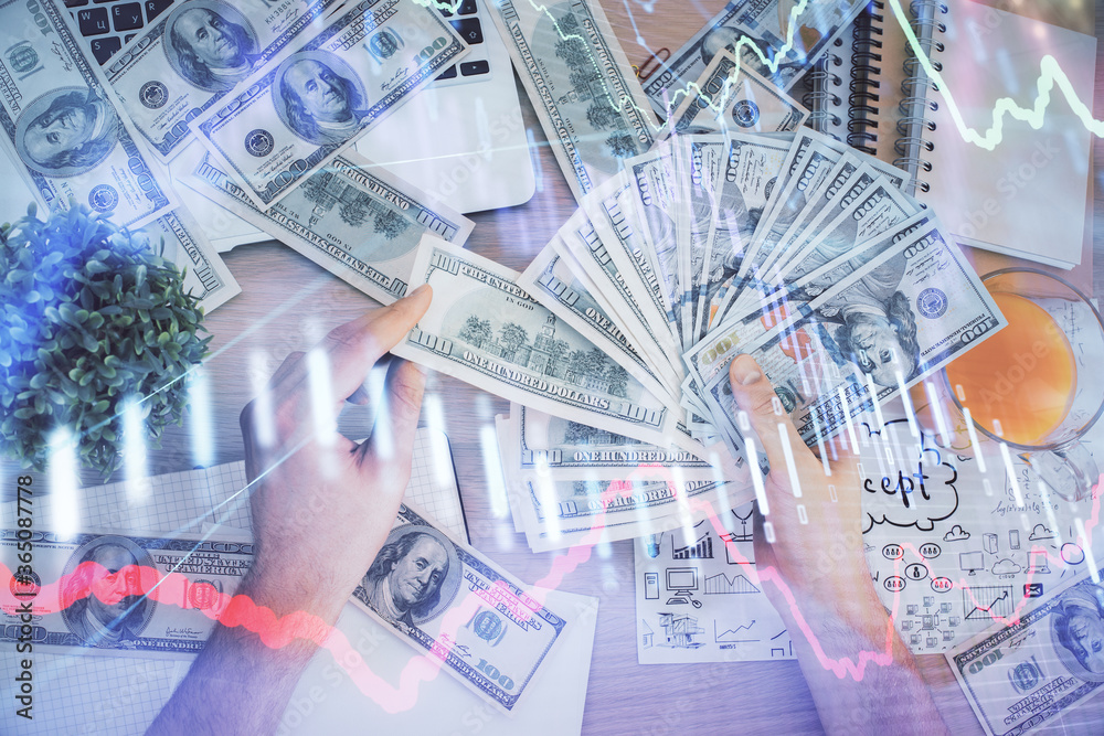Multi exposure of financial graph drawing hologram and USA dollars bills and man hands. Analysis concept. Multi exposure of financial graph drawing hologram and USA dollars bills and man hands. Analysis concept.