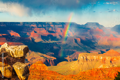 Panoramic image of the colorful rainbow over the Grand Canyon in Grand Canyon National Park from the south rim part,Arizona,USA, sunset on a sunny cloudy day with blue sky
