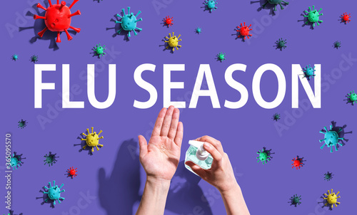 Flu Season Coronavirus theme with person using hand sanitizer