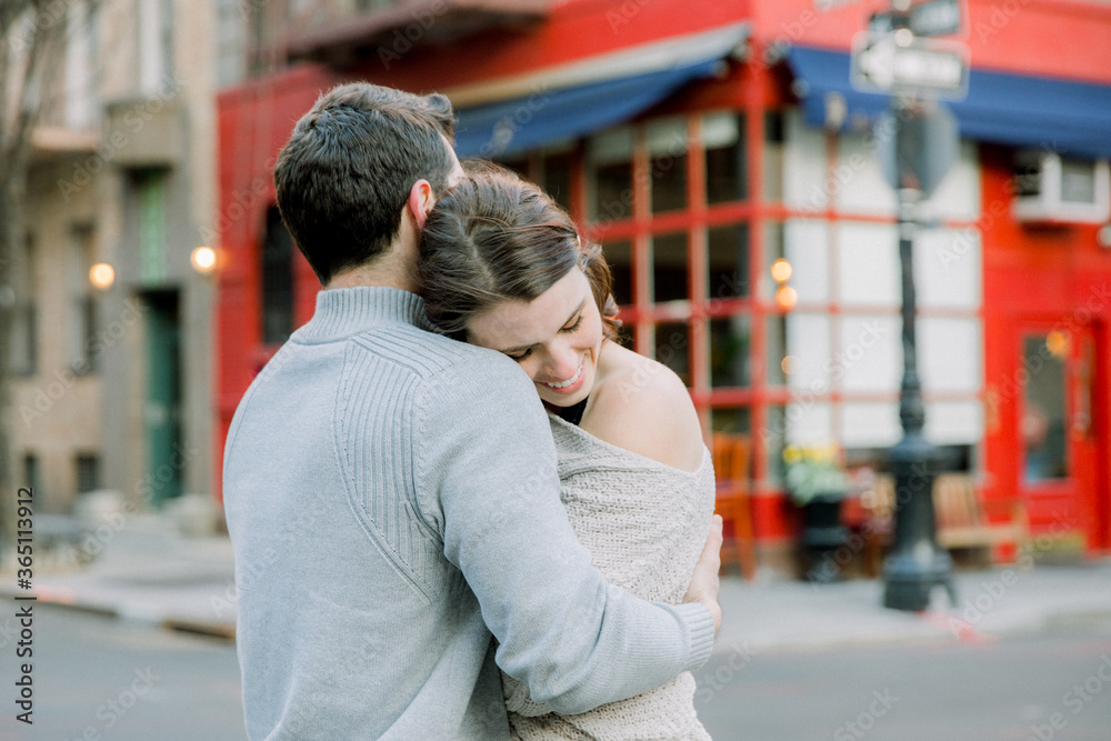 A young couple having a romantic moment in front of  famous 