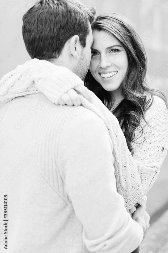 A happy young couple having a romantic moment in an urban setting in West Village in NYC A happy young couple having a romantic moment in an urban setting in West Village in NYC
