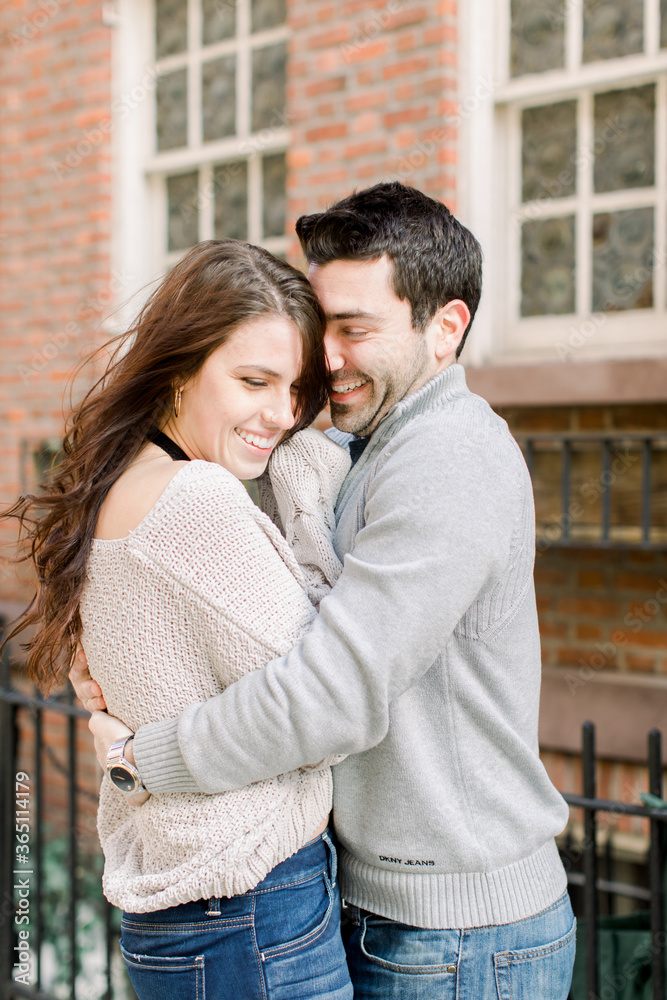 A happy young couple having a romantic moment in an urban setting in West Village in NYC