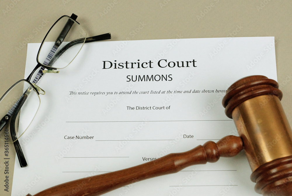 Summons Form for a District Court with gavel. Summons Form for a District Court with gavel.