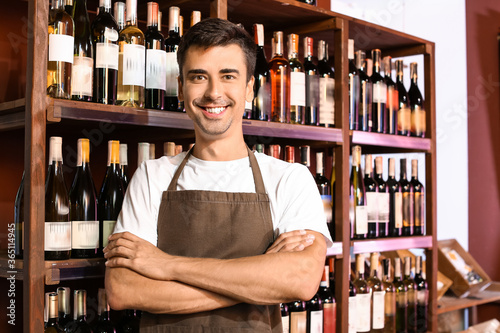Male seller in wine store