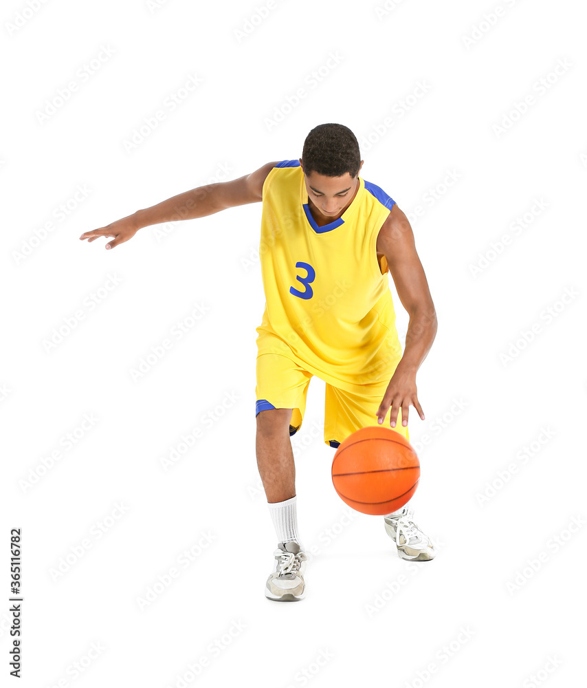 Fototapeta premium Young African-American basketball player on white background