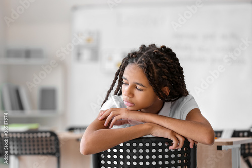 Sad African-American girl a...