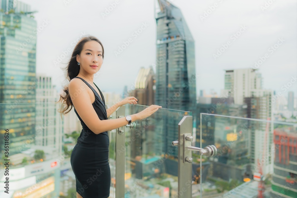 Portrait beautiful young asian woman relax enjoy restaurant on the rooftop