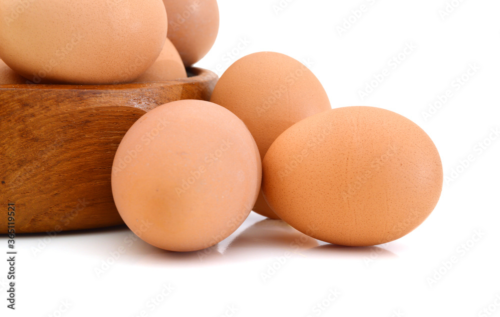Raw eggs isolated in wooden bowl white background Raw eggs isolated in wooden bowl white background