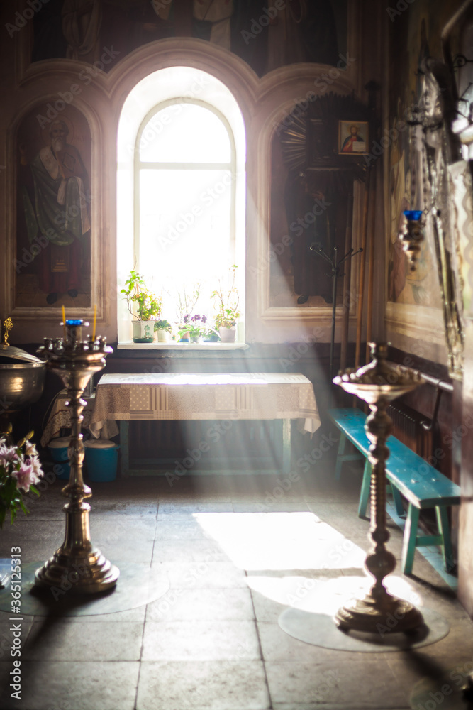 Beautiful bright light shines in the window of the temple.