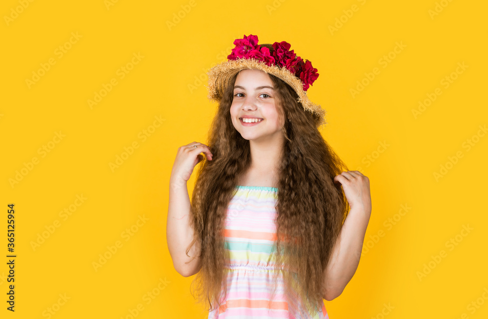 small girl with summer rose in hat. summer holiday and vacation. female beauty and fashion. childhood happiness. happy kid with floral decor in headwear. child in spring hat small girl with summer rose in hat. summer holiday and vacation. female beauty and fashion. childhood happiness. happy kid with floral decor in headwear. child in spring hat
