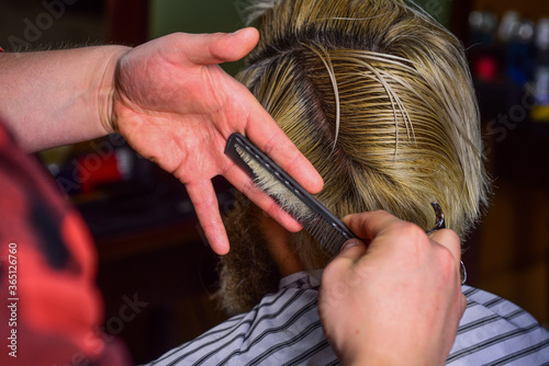 Barber scissors. Manage your expectations. Guy with long dyed blond hair close up rear view. Cut hair. Barber making hairstyle for bearded man barbershop background. Hipster client getting haircut