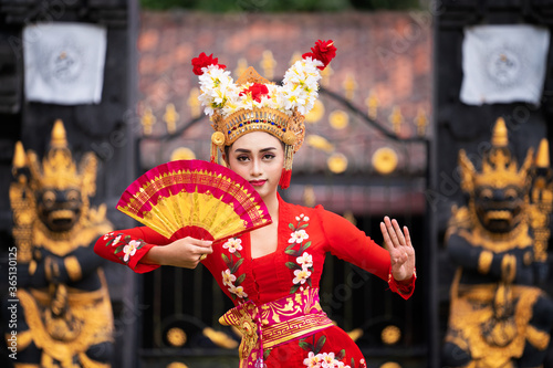 Balinese girl performing traditional dress photo