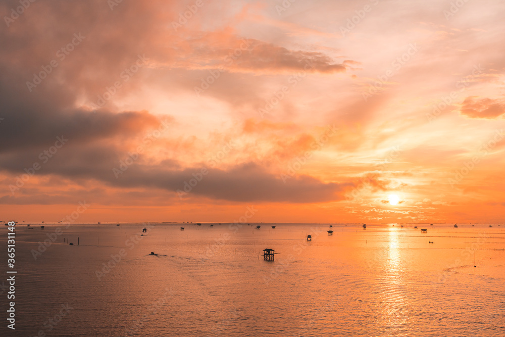 Fototapeta premium colorful dramatic sky with cloud at sunset on sea