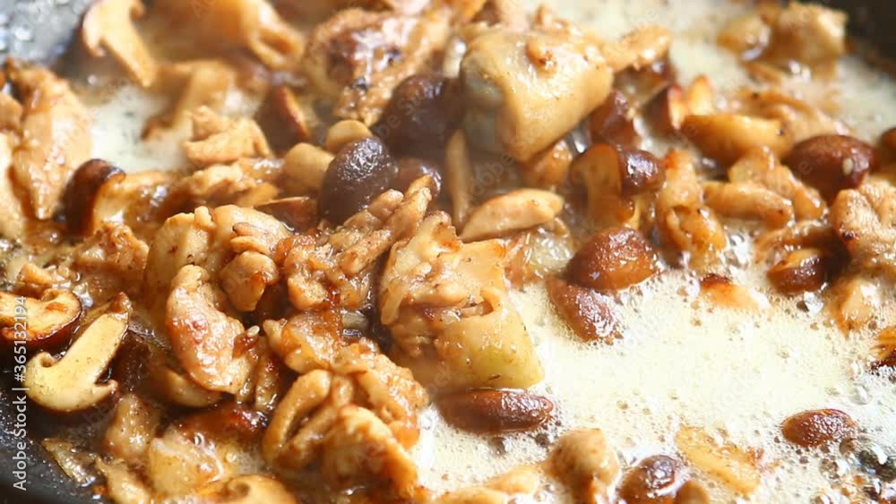 Frying chicken with shiitake mushroom in pan, in door Chiangmai Thailand Frying chicken with shiitake mushroom in pan, in door Chiangmai Thailand