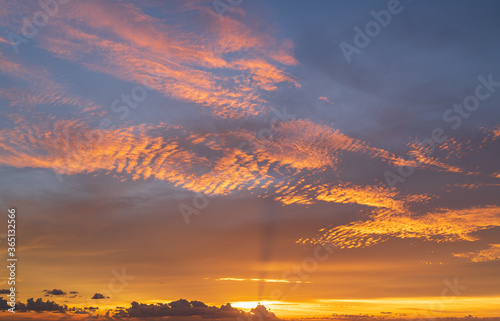 Abstract amazing Scene of stuning Colorful sunset with clouds background in nature and travel concept, wide angle shot Panorama shot. © boophuket