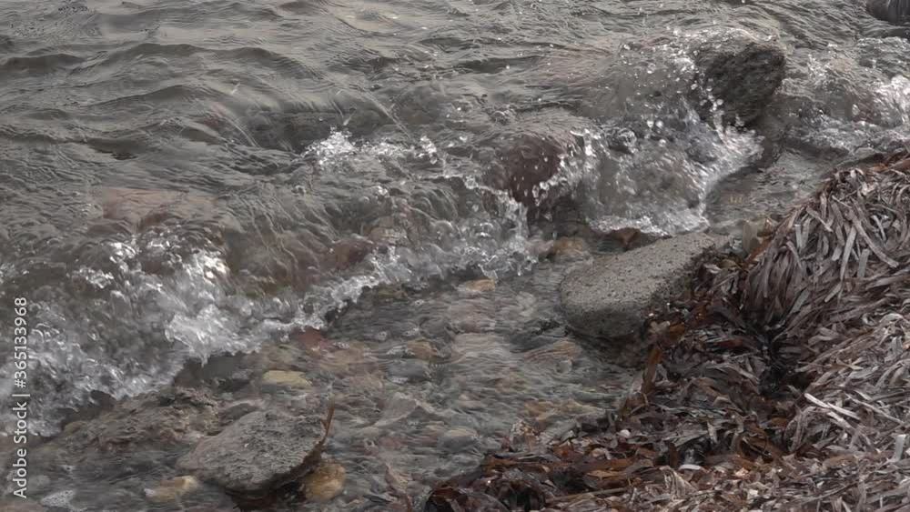 Stone seashore. Sea waves in slow motion Stone seashore. Sea waves in slow motion