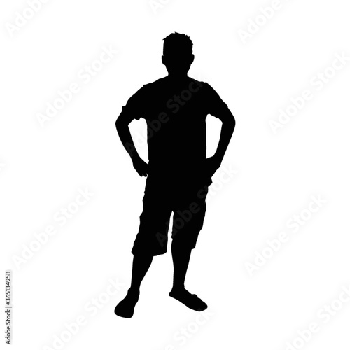 silhouette of man standing with hands on hips