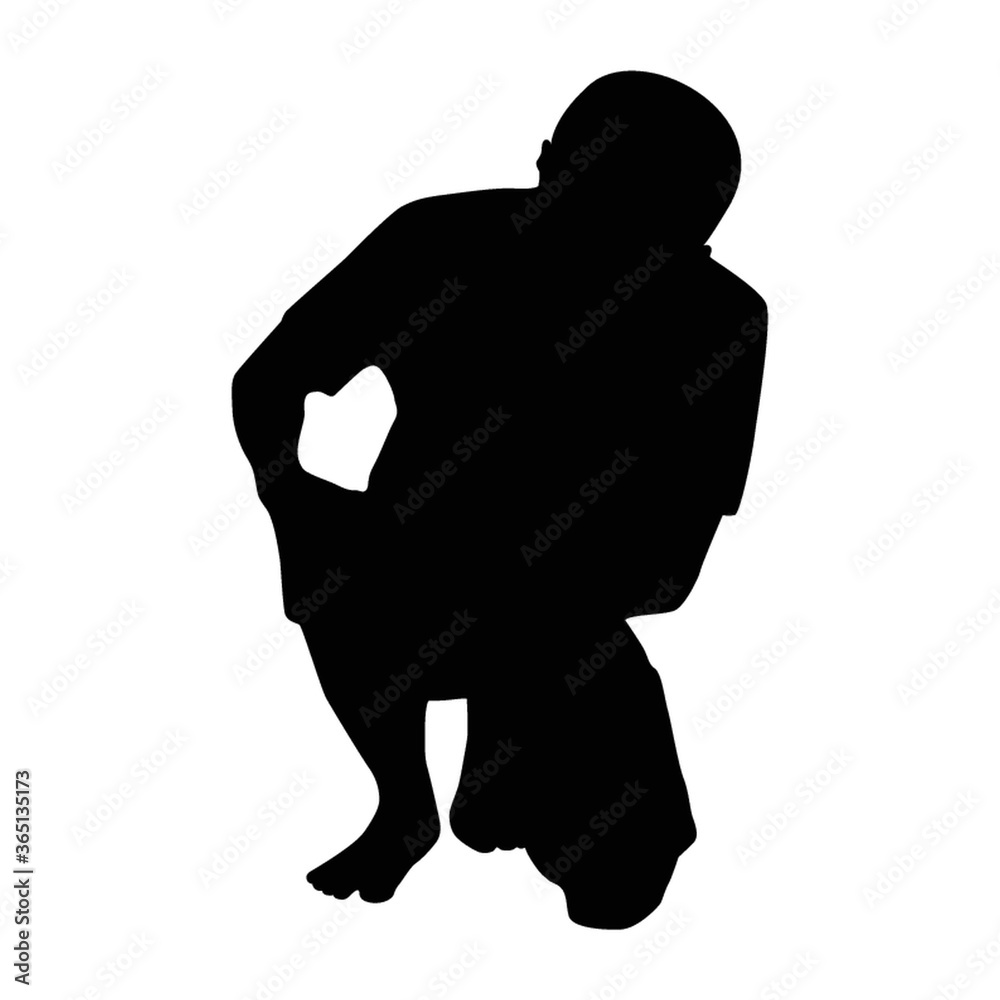silhouette of holding his knee