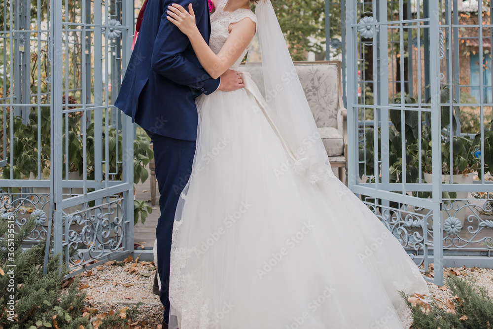 bride and groom together in the park at wedding bride and groom together in the park at wedding