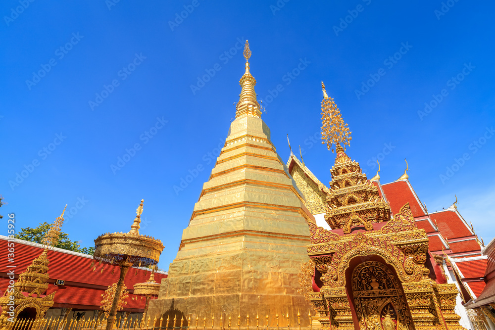 Fototapeta premium Golden pagoda for year of tiger zodiac at Wat Prathat Cho Hae Temple in Phrae province, north of Thailand
