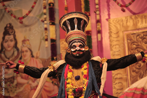 Kathakali hero in black face paint  photo