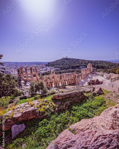 Athens Greece, Herodium ancient open theater under acropolis and panoramic view of the city photo