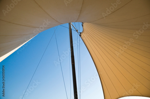 Abstract photo of a canvass canopy - a shelter or shade made with stretched canvas. An architectural details.