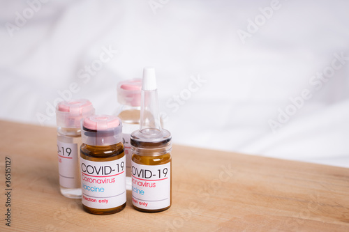 Bottle of coronavirus vaccine on table. Coronavirus vaccine COVID-19. 2019. 