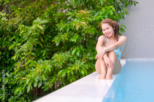 young woman relaxing in the pool © Hide_Studio