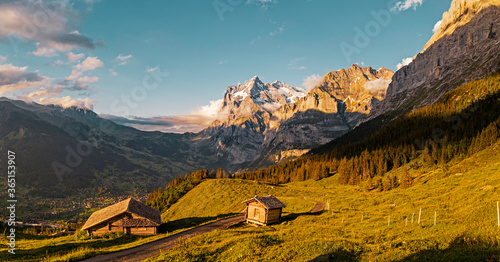 Aerial view of  small alpine mountain huts in the high alps of the grindelwald valley in Switzerland.