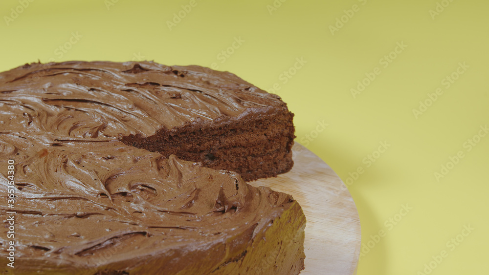 CLOSE UP: Chocolate cake without one piece - Side view CLOSE UP: Chocolate cake without one piece - Side view