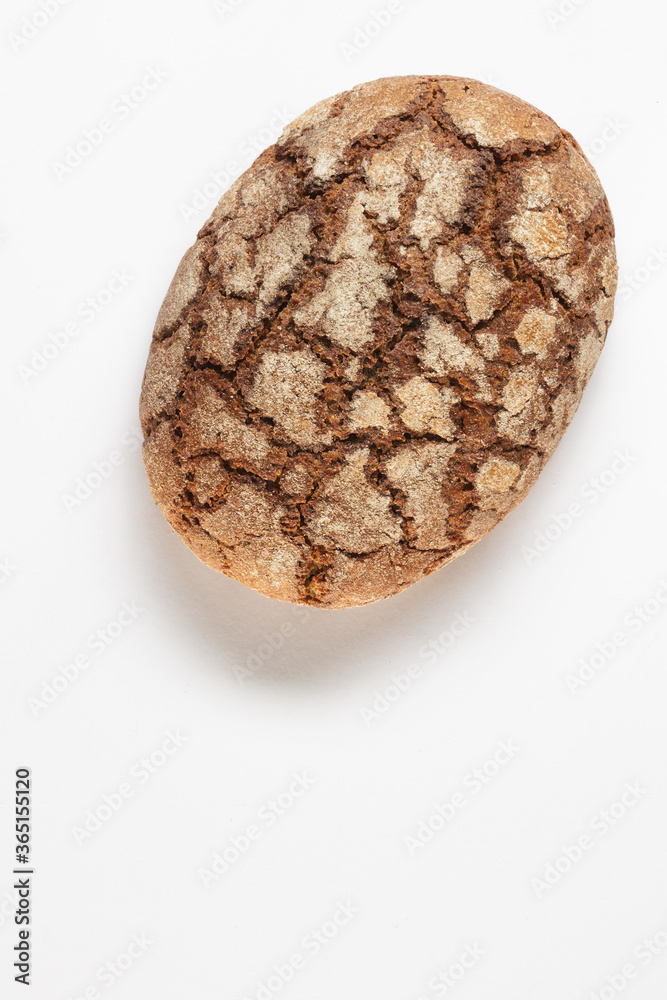 Traditional rye bread on a white background. Top view. Healthy food concept. Traditional rye bread on a white background. Top view. Healthy food concept.