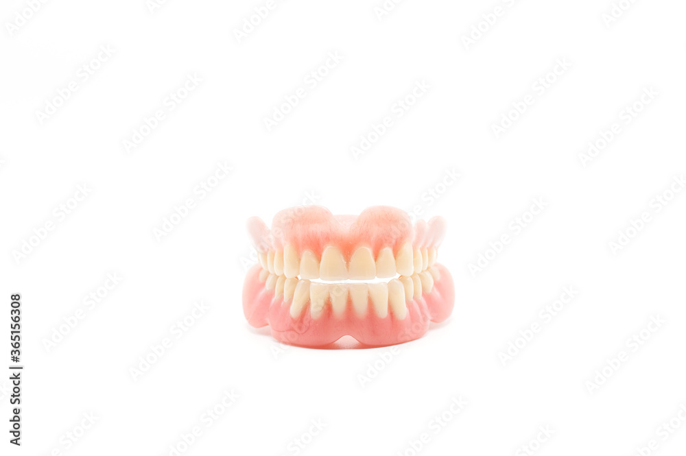 Obraz premium Dentures isolated on a white background. Denture, close up.