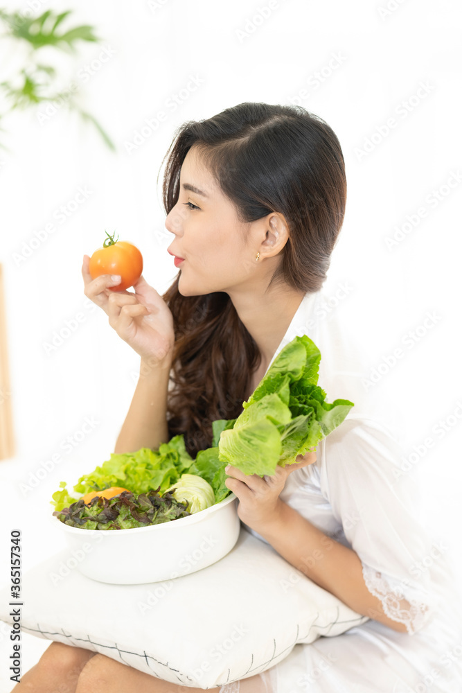 Smiling young woman holding fresh vegetables and fruits in hands Smiling young woman holding fresh vegetables and fruits in hands