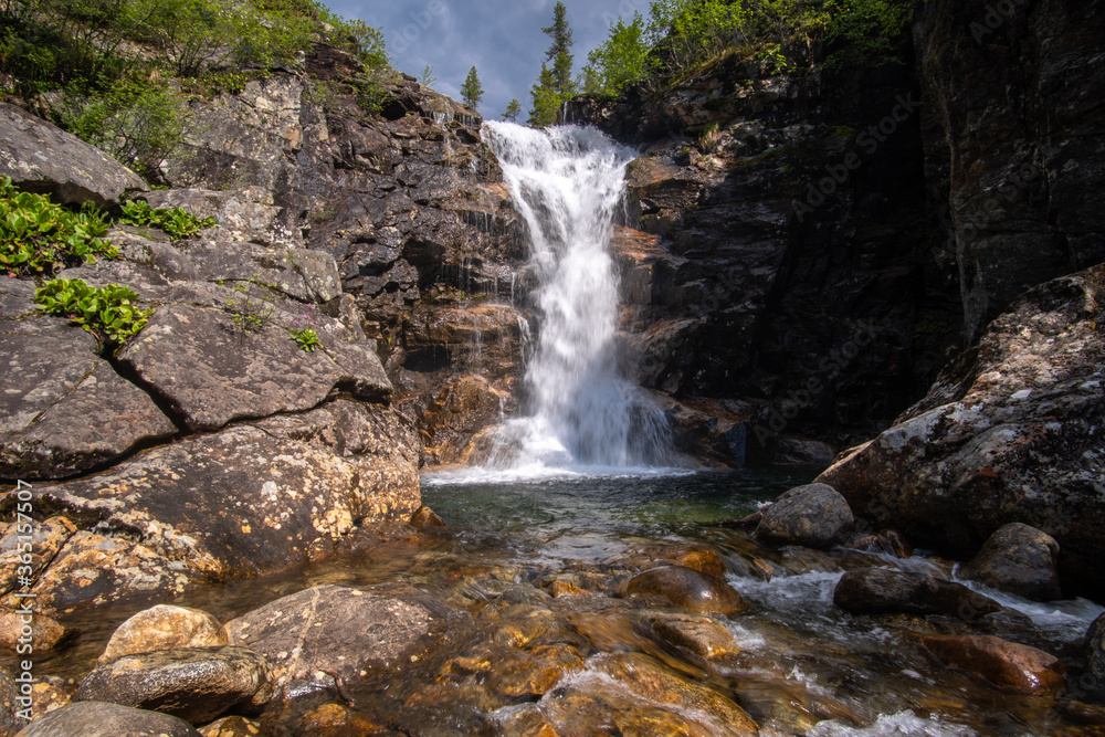 Waterfall on the Podkomarnaya River in the Khamar-Daban Mountains