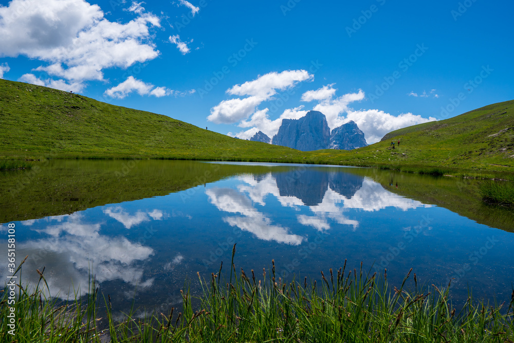 A magical panorama landscape with a lake in the mountains in the Dolomites Alps, Europe. Passo giau