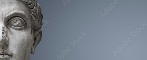 Fotografia Banner with head of Roman Nobel Man as marble ancient statue isolated at grey and blue gradient background with copy space for text, Rome, Italy