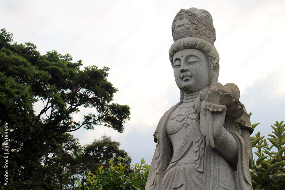 The statue of Kanon or Guanyin and stupa at Myohoji temple in Beppu, Japan The statue of Kanon or Guanyin and stupa at Myohoji temple in Beppu, Japan