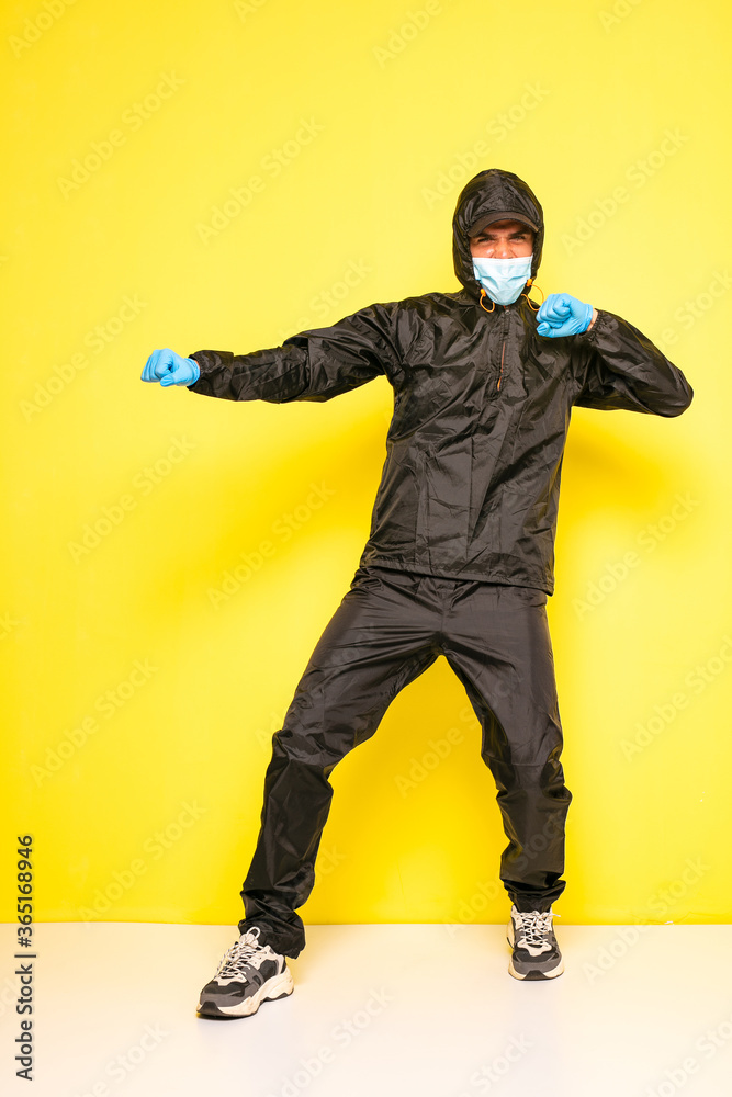 man in full body black costume man in full body black costume