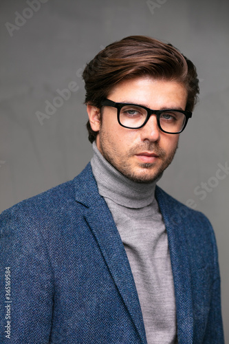 elegant stylish man on grey