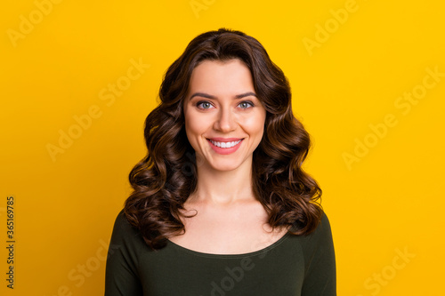 Close-up portrait of her she nice-looking attractive lovely lovable pretty winsome cheerful cheery wavy-haired lady isolated on bright vivid shine vibrant yellow color background