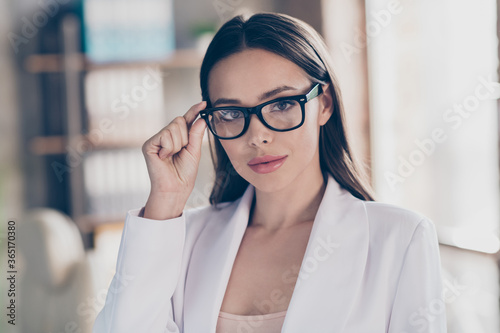 Closeup photo of attractive beautiful business lady hold touch arm hand specs eyesight care concept home spacious office social distance formal wear blazer white suit indoors