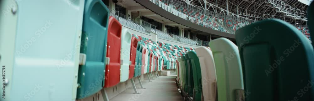 WIDE View of empty stadium seats before game or during Coronavirus COVID-19 pandemic. Shot on RED cinema camera